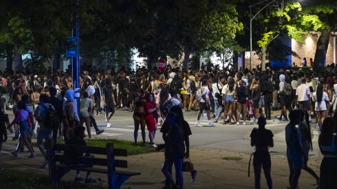 Hundreds of people gather for a "teen takeover" near the Griffin Museum of Science and Industry on the South Side