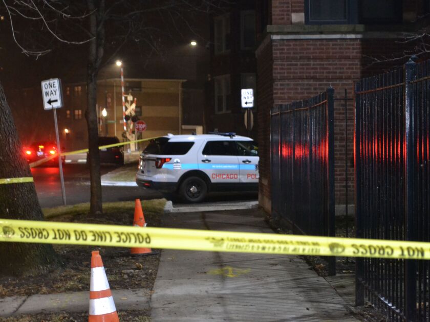 Police investigate the shooting of a 18-year-old man Friday evening in the 7400 block of South Colfax. | Justin Jackson/Sun-Times