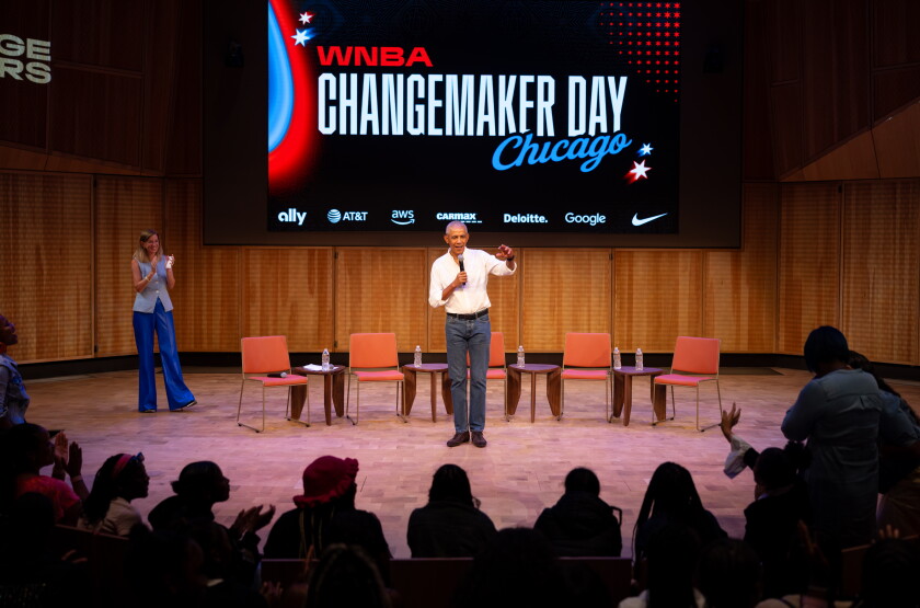 Former President Barak Obama surprises a group of high school freshman girls Friday during the WNBA Changemaker Day at the Obama Presidential Center in Jackson Park on the South Side.