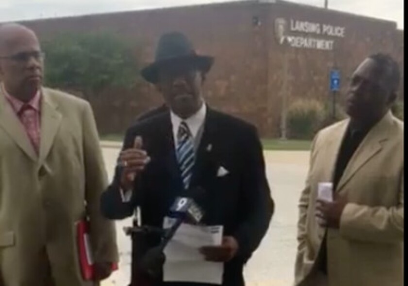 From left, gubernatorial candidate Tio Hardiman, Eric A. Russell and Mark Clements speak at a press conference calling for the firing of a white Lansing police officer seen threatening a black teen in a video. | Facebook