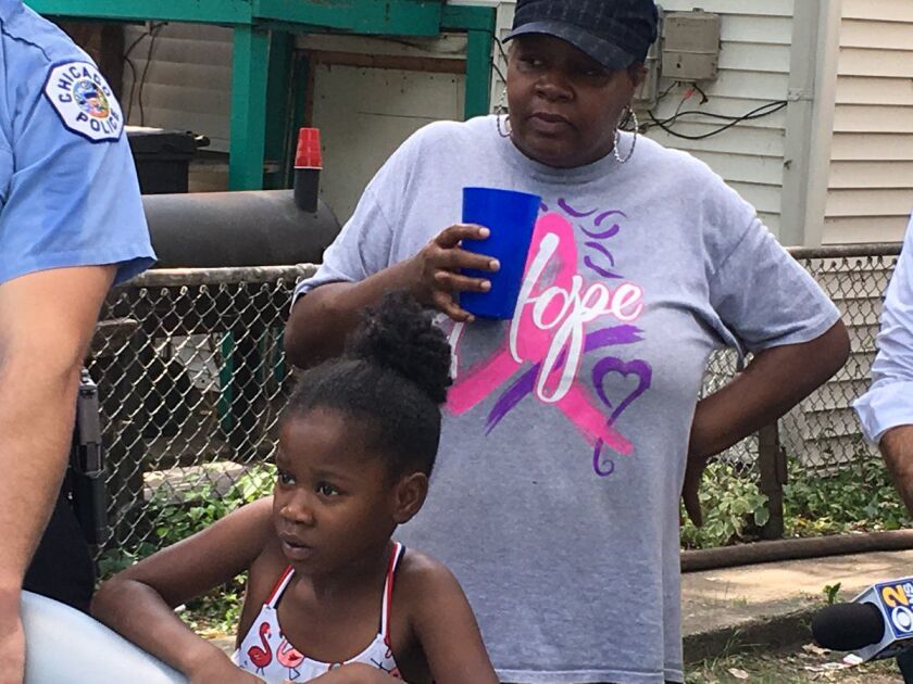 Tacarra and her mother, Carolyn Morris, watch as the pools fills up with water. | Maudlyne Ihejirika/Sun-Times