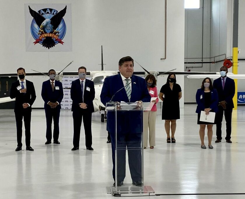 Gov. J.B. Pritzker speaks at the ribbon-cutting ceremony at the Aviation Institute of Maintenance’s new training center, at 3711 S. Ashland on Wednesday. 
