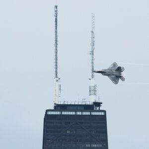 A pilot flies an F-22 near the John Hancock Building during the Air and Water Show at North Avenue Beach, Saturday, Aug. 20, 2022. | Pat Nabong/Sun-Times