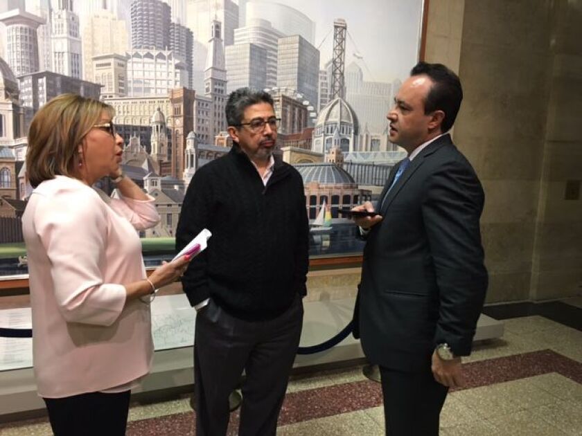 Ald. Millie Santiago (31st), Danny Solis (25th) and George Cardenas (12th) talk before a City Hall news conference Friday. | Fran Spielman/Chicago Sun-Times