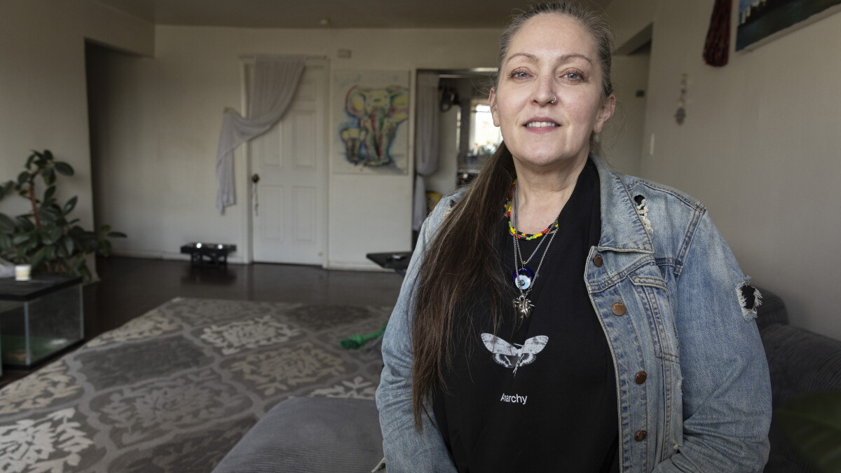 A Section 8 Housing Choice Voucher holder inside her home.