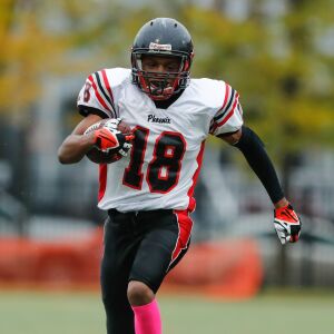 Phoenix’s Lavelle Parker (18) runs the ball against Marine.