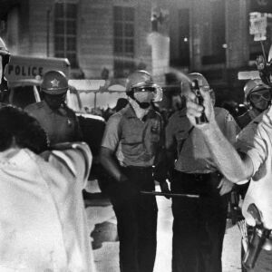 A Chicago Police officer sprays mace into a crowd as police try to break up demonstrations. | Sun-Times files