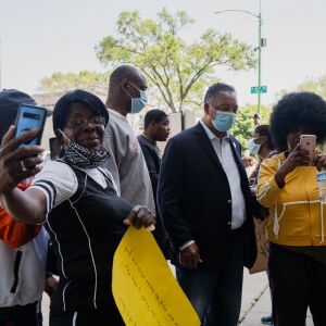 Rev. Jesse Jackson takes pictures with community activists and residents during the “In the Spirit of King” march in front of 1550 S. Hamlin Ave. where Martin Luther King Jr. used to live. June 12, 2020.