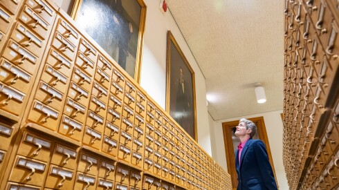 Jill Austin, Vice President of Public Engagement at Newberry Library looks up at portraits of Ulysses S. Grant and Abraham Lincoln painted by George P. A. Healy inside the library’s card catalog room, Tuesday, March 24, 2026