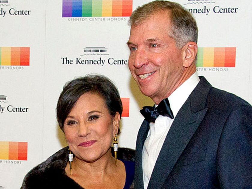 Penny Pritzker and her husband, Dr. Bryan Traubert | Getty Images