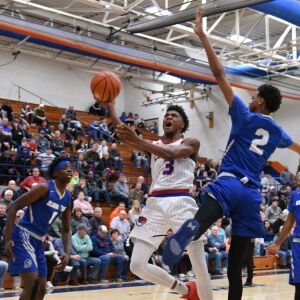 DaJuan Gordon (3) of Curie makes a layup over Bloom’s Matrice Mitchell (2), Saturday 12-29-18. Worsom Robinson/For Sun-Times
