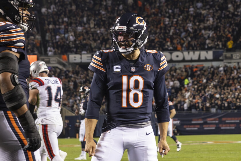 Chicago Bears quarterback Caleb Williams #18 celebrates after running back D’Andre Swift #4 ran in a touchdown during the first quarter against the New England Patriots at Soldier Field, Thursday, Oct. 22, 2026. | Ashlee Rezin/Sun-Times