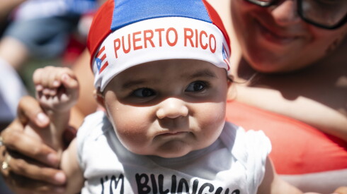 Jorgie, who is 8 months old, attends the Puerto Rican People’s Day Parade on West Division Street in Humboldt Park, Saturday, June 13, 2026.