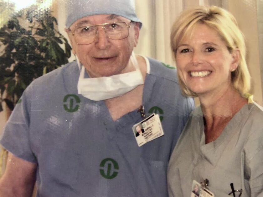 Dr. Randall McNally with his daughter Sheila, who was his operating room nurse.