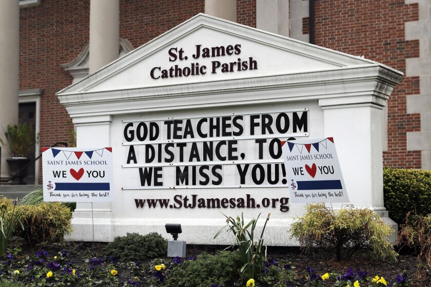 A sign at St. James Catholic Parish in Arlington Heights on May 14.