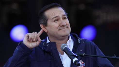 Cubs chairman Tom Ricketts gesturing to a crowd in 2016.
