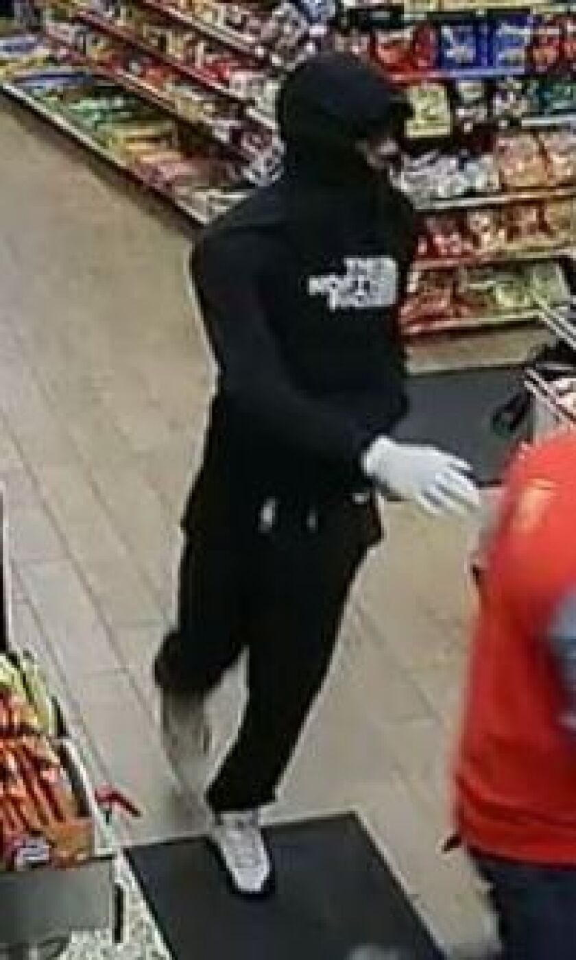 Surveillance photo of one of two suspects who robbed a Glendale Heights gas station at gunpoint. | Glendale Heights police