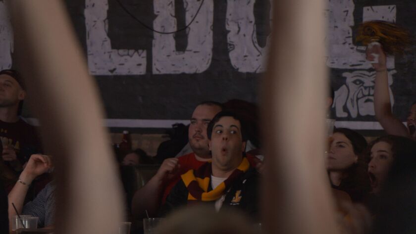 Loyola fans cheer on the Ramblers at the Bulldog Ale House during their Elite Eight victory on Saturday. | Annie Costabile/Sun-Times