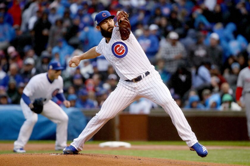 <em>Jake Arrieta pitches in the first inning during Game 4. (Getty Images)</em>