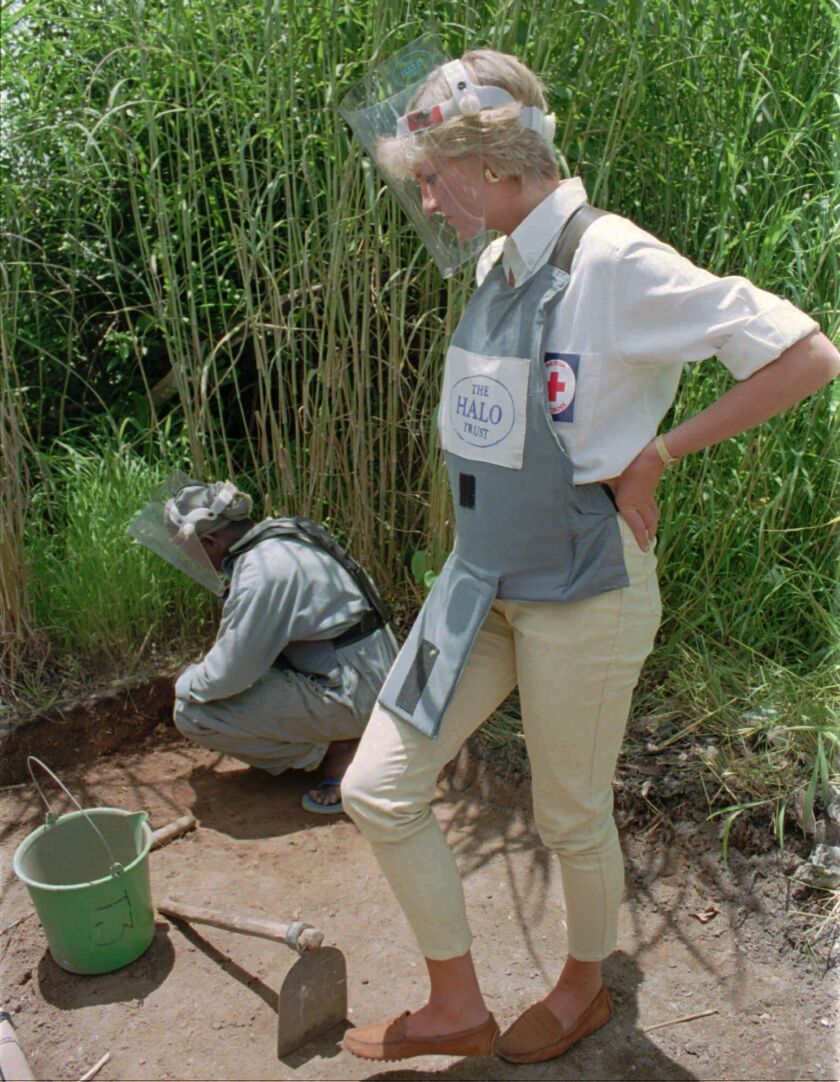 In this Jan. 15, 1997 file photo, Diana, Princess of Wales, wearing protective gear, watches a land-mine clearing demonstration in Huambo, central Angola, one of the most densely mined areas in the country.