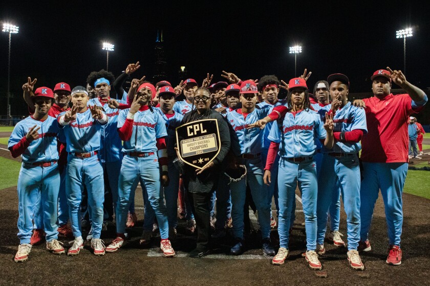 Kenwood Players Pose for a Photo With Principal Karen Calloway and the City Championship Trophy after Beatting Lane at Uic's Curtis Grandereson Stadium.