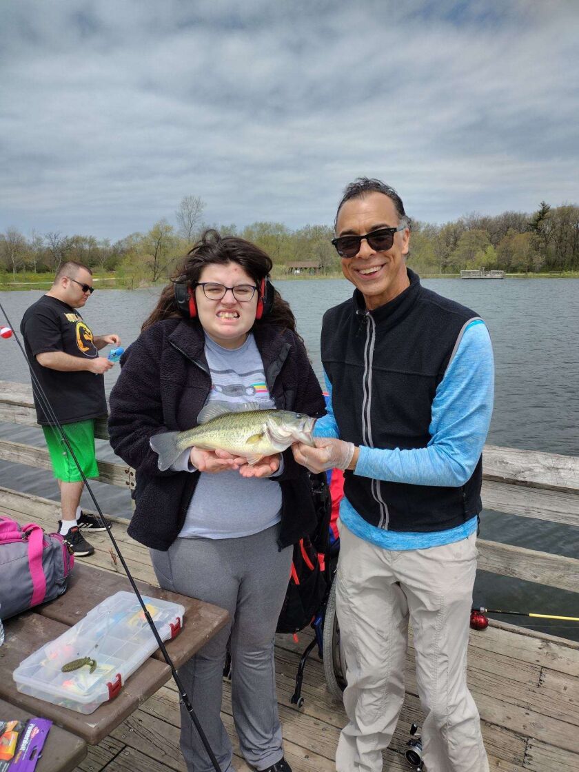 An outing by the Leyden fishing club with Rob Abouchar at Wood Dale Grove produced a nice largemouth bass, which student Reba wanted to hold. Provided photo