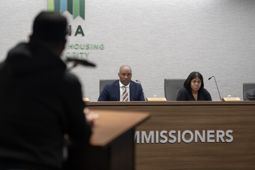 Chicago Housing Authority Board Chair and temporary Operating Chairman Matthew Brewer sits behind a podium, during a special meeting of the CHA Board of Commissioners in September.