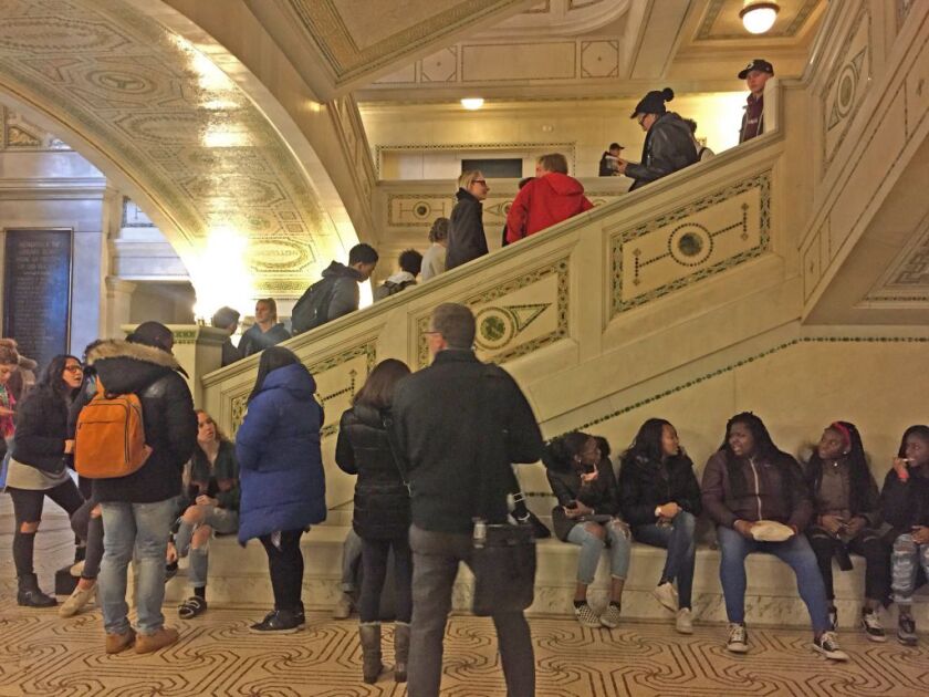 Dozens of high schoolers waiting in the Chicago Cultural Center Monday afternoon in hopes of performing and seeing Chance the Rapper at OpenMike. | Julie Whitehair/For the Sun-Times