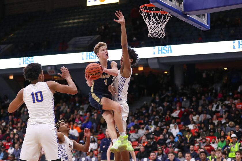 High school basketball: Ten post-summer thoughts and observations on the June and July live periods 2 Lemont’s Matas Castillo (1) goes to the basket against Simeon.