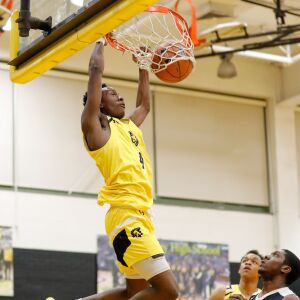 Orr’s Shaun Harris (4) dunks the ball against Corliss.