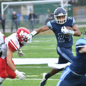 Nazareth’s Derrick Strong Jr. (24) breaks out of the back field. Worsom Robinson/For the Sun-Times.