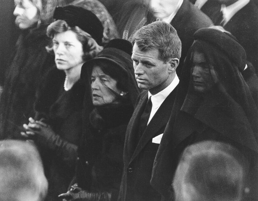 In this Nov. 25, 1963, file photo, members of the Kennedy family attend U.S. President John F. Kennedy’s burial at Arlington National Cemetery in Arlington, Va., including JFK’s mother, Rose Kennedy (center left with veil); his brother U.S. Attorney Gener