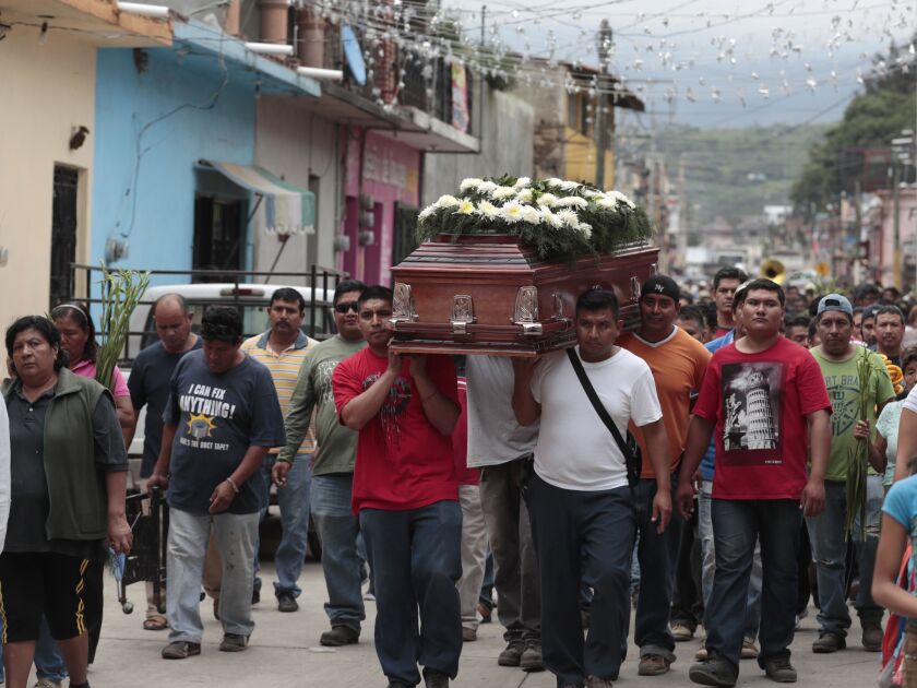 Residents on Wednesday carry the casket of a woman who died in Tuesday’s earthquake, in Tlayacapan, Morelos state, Mexico. | Eduardo Verdugo/Associated Press