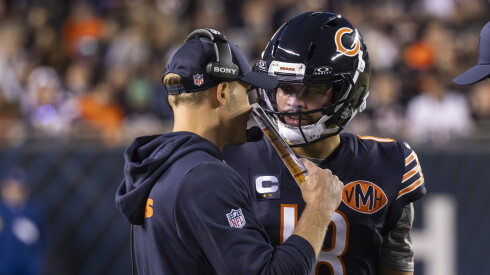 Bears quarterback Caleb Williams speaks with head coach Ben Johnson during the first quarter against the Minnesota Vikings at Soldier Field on Monday, Sept. 8, 2025.
