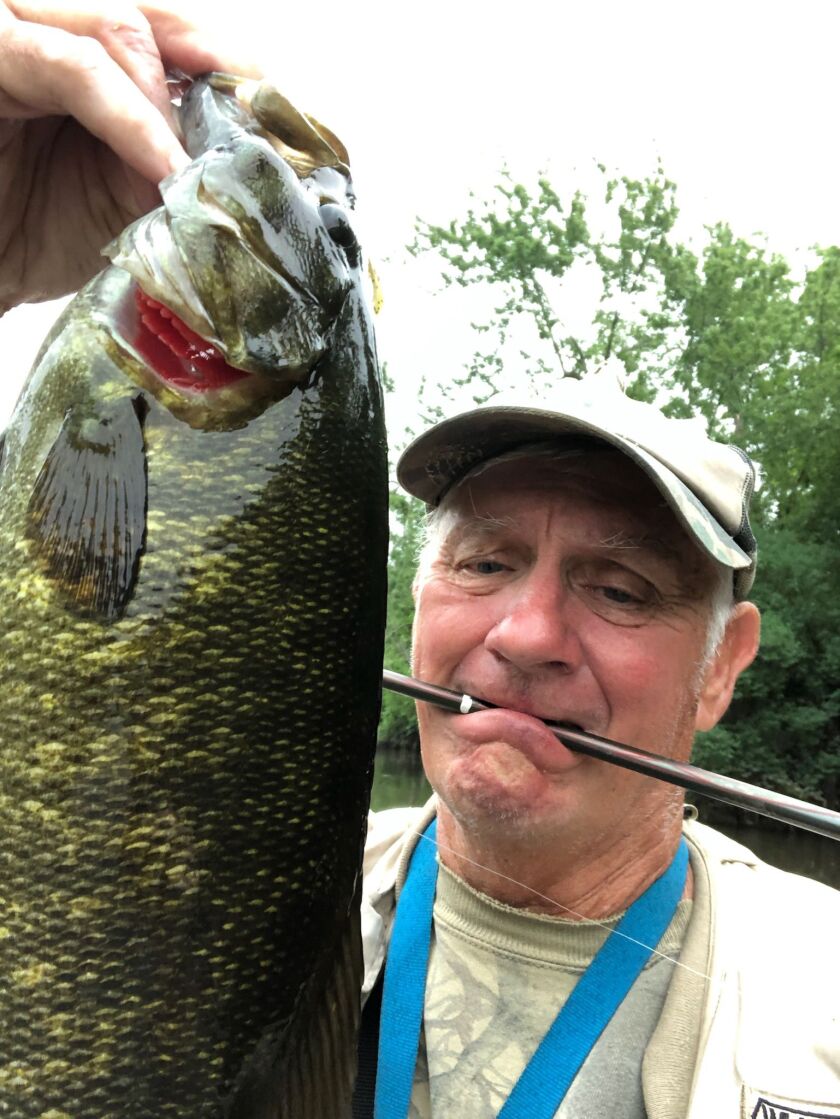 George Peters holds a good smallmouth bass from the Kankakee River. Provided photo