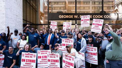 Picketing outside a government building by Teamsters Local 700 amid a strike against the Cook County Forest Preserve District.
