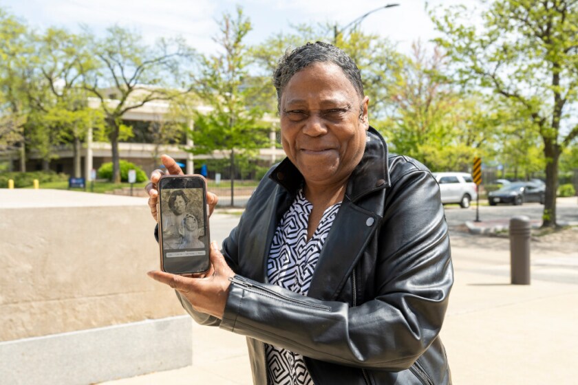 Kathy Teague holds up a hand drawn portrait of her and her missing daughter Vinyette Teague, during the fifth Cook County Missing Persons Day at the Cook County Medical Examiner’s Office, Saturday, May 10, 2025, in Chicago.