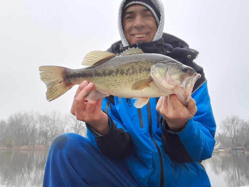 Rob Abuchar holds a largemouth bass caught over the long Christmas weekend from open water on Island Lake. Provided photo