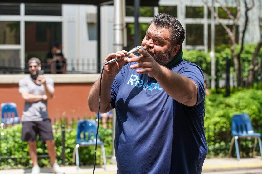 Singer John Vincent performs outside the Lakeside Senior building at 920 W. Lakeside Place.