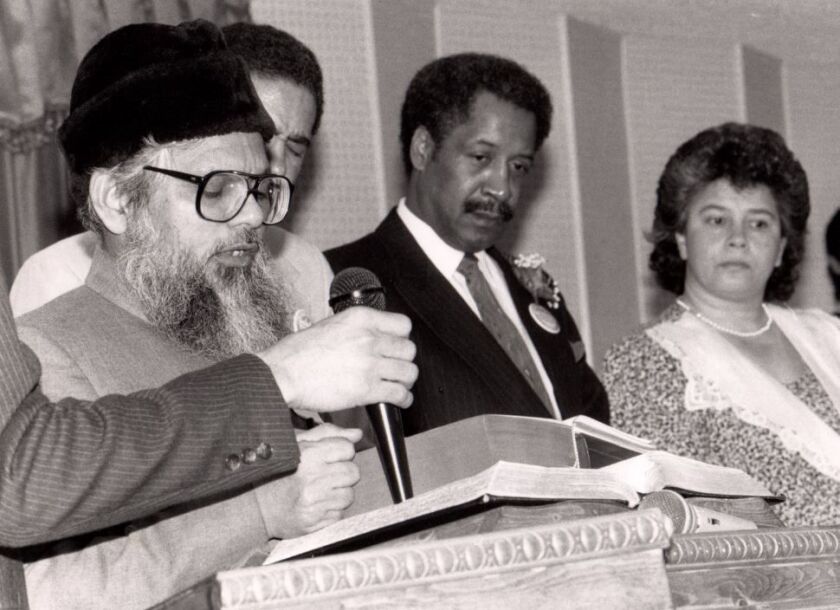 Irfan Ahmad Khan, with then-Mayor Eugene Sawyer in the background. | Provided photo