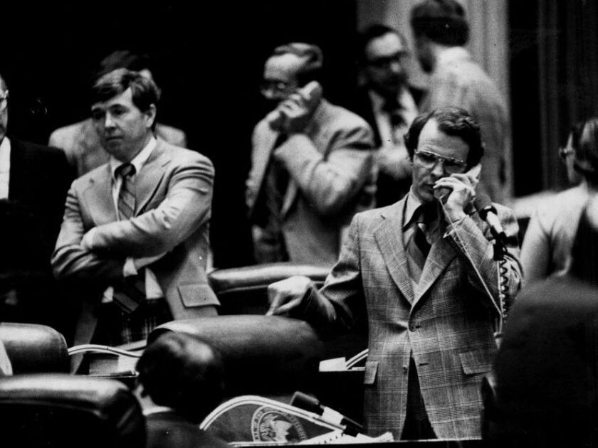 State Rep. Michael Madigan talks on the phone on the House floor in 1979. File Photo.