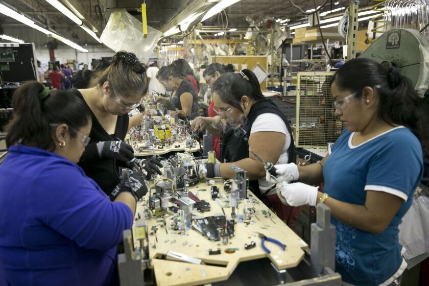 Workers assemble games at Stern Pinball. | Sun-Times file photo