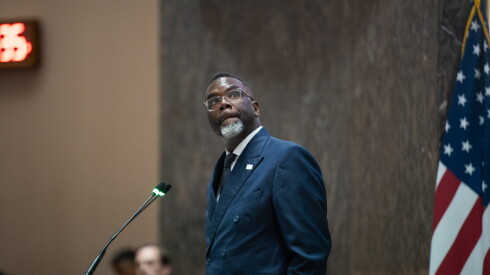 Mayor Brandon Johnson watches votes get counted.