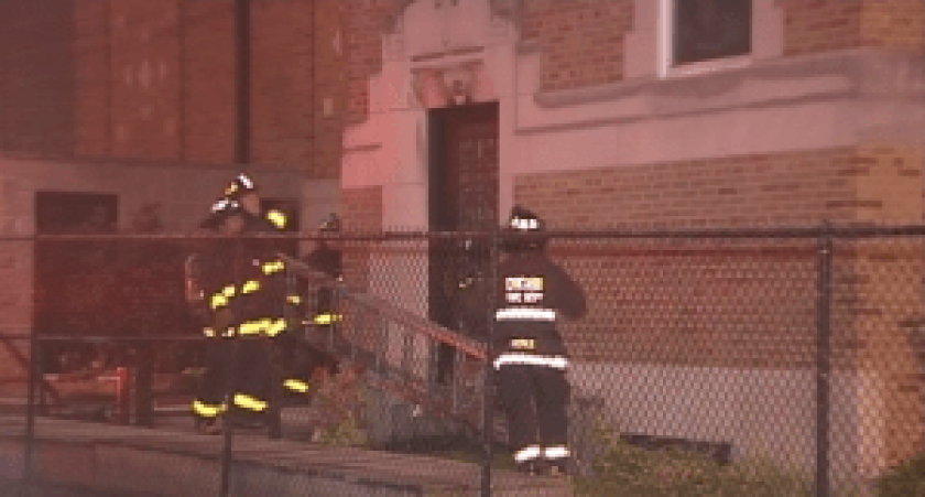 Firefighters work to extinguish a blaze at St Genevieve Church, 4835 W. Altgeld St., early Monday. | Network Video Productions