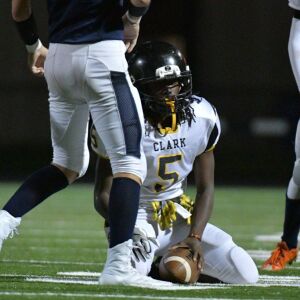 Clark’s Elijah Blizzard (5) after being tackled. Worsom Robinson/For the Sun-Times.