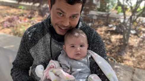 Diego Damis, 41, holds his niece. He was the victim of a fatal stabbing in Kenwood Feb. 25.
