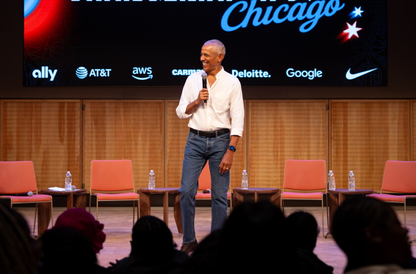 Former President Barak Obama surprises a group of high school freshman girls Friday during the WNBA Changemaker Day at the Obama Presidential Center in Jackson Park on the South Side.