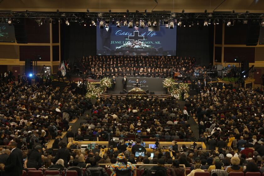 A diverse crowd fills the House of Hope