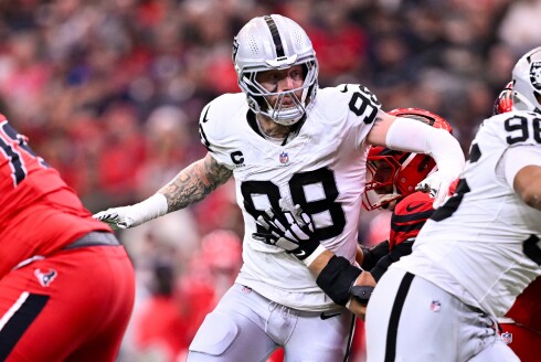 Las Vegas Raiders defensive end Maxx Crosby (98) rushes during the first half of an NFL football game against the Houston Texans, Dec. 21, 2025, in Houston.