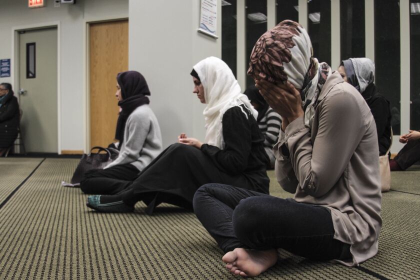 Muslim women pray at the Council of Islamic Organizations headquarters in 2017.